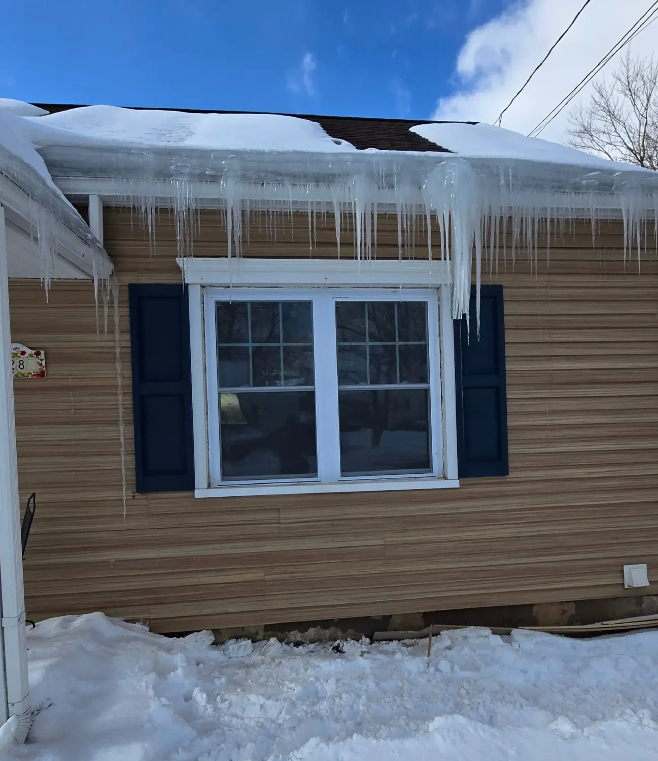 New double-slider vinyl window with white trim by Drexler Home Services in Fairport NY
