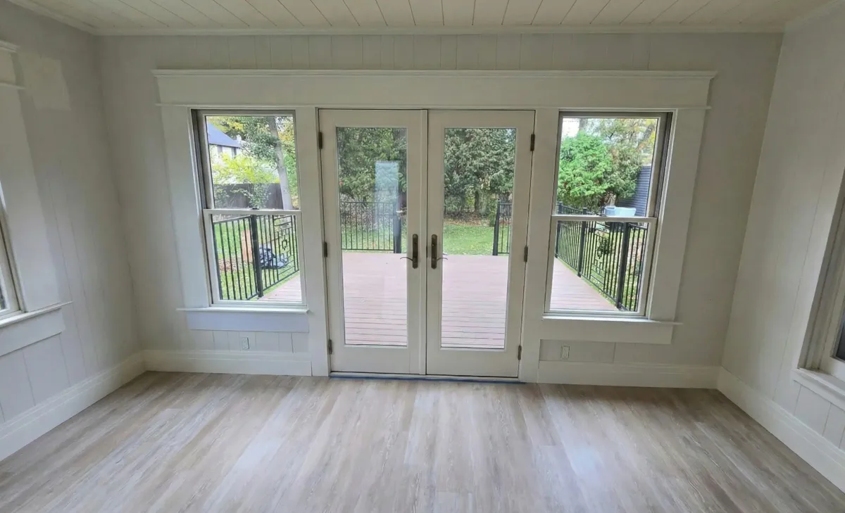 New sunroom with hardwood floors and shiplap by Drexler Home Services in Rochester NY